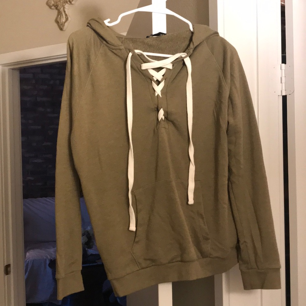 A sweater with white tie in front